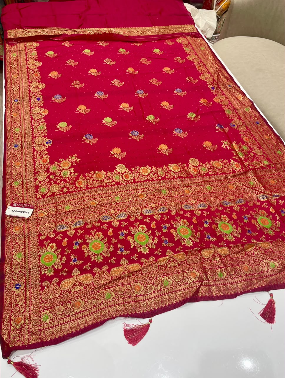 AJ-DHRUVIKA CHAMPION SILK FABRIC SAREE WITH RICH PALLU DESIGN WITH MEENAKARI WORK WITH FLORAL DESIGN WITH BORDER WITH PIPING AND TASSELS WITH BLOUSE